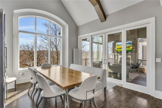 dining room featuring dark hardwood / wood-style flooring, french doors, and vaulted ceiling with beams