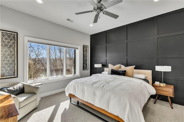 bedroom with ceiling fan and light colored carpet