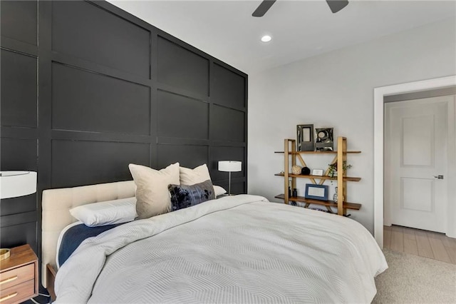 bedroom with ceiling fan and hardwood / wood-style flooring