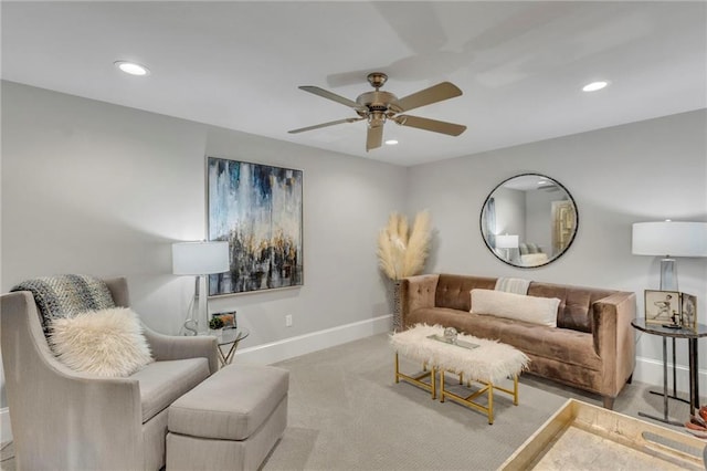 living room featuring ceiling fan and carpet floors