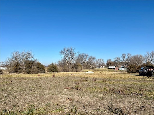 view of yard with a rural view