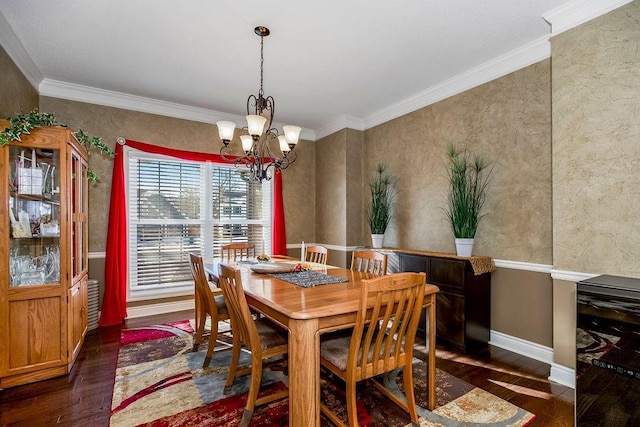 dining room with dark wood-type flooring, crown molding, and a chandelier