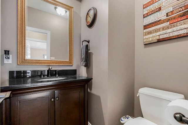 bathroom with toilet and vanity