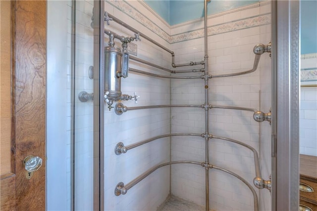 bathroom with a shower with door