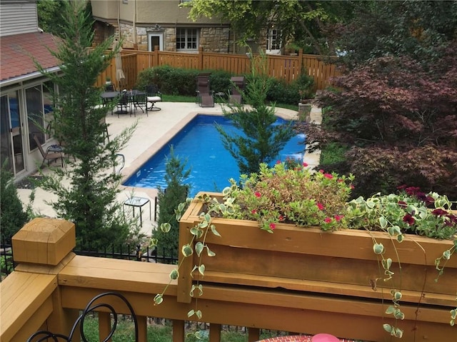 view of swimming pool featuring a patio