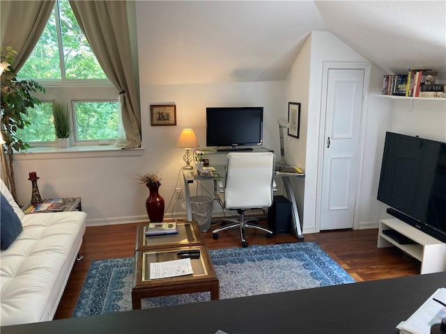 office featuring vaulted ceiling and dark hardwood / wood-style floors