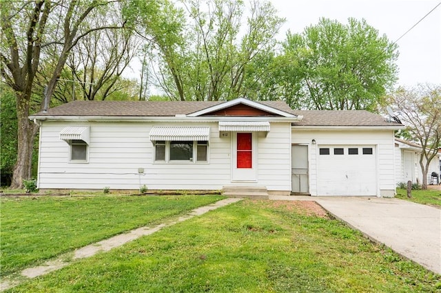 ranch-style home with a garage, concrete driveway, and a front yard