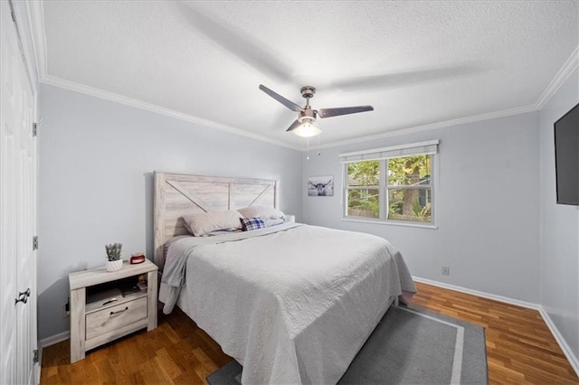 bedroom with a textured ceiling, ceiling fan, ornamental molding, and dark hardwood / wood-style floors