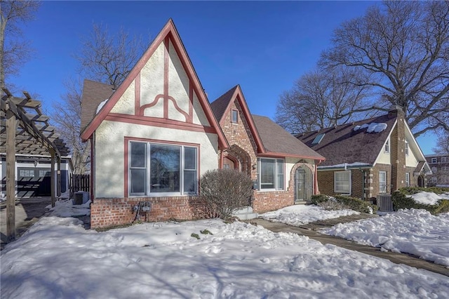 tudor home featuring central AC