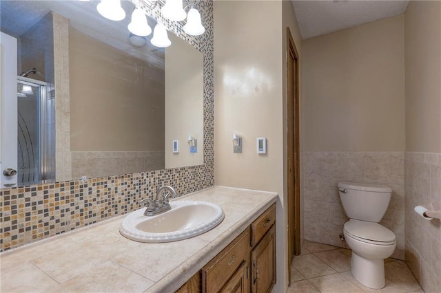 bathroom with tile patterned floors, vanity, and toilet