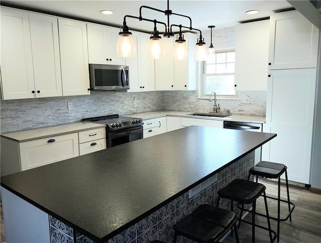 kitchen featuring white cabinets, sink, and black electric range oven