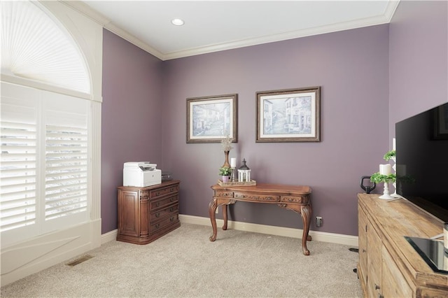 home office featuring crown molding and light carpet