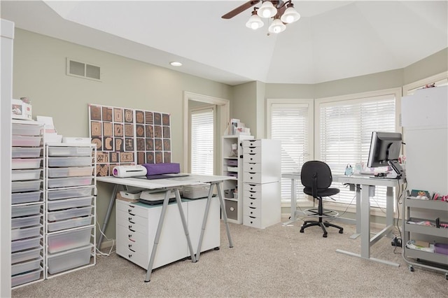 office space featuring lofted ceiling, light carpet, and ceiling fan