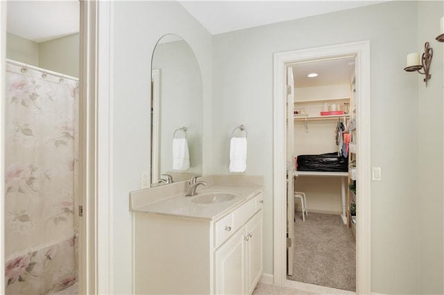 bathroom with a shower with curtain and vanity