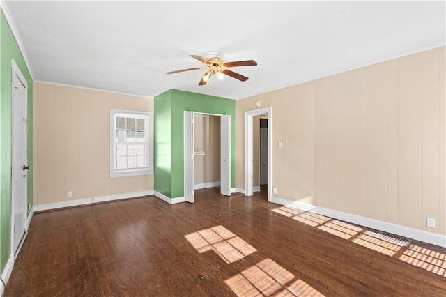 unfurnished bedroom with dark wood-type flooring and ceiling fan