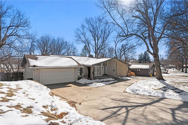 ranch-style home featuring a garage