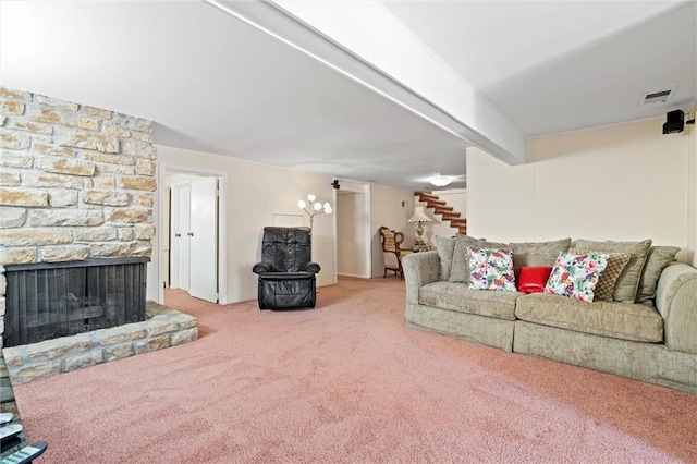 living room with a fireplace and carpet flooring