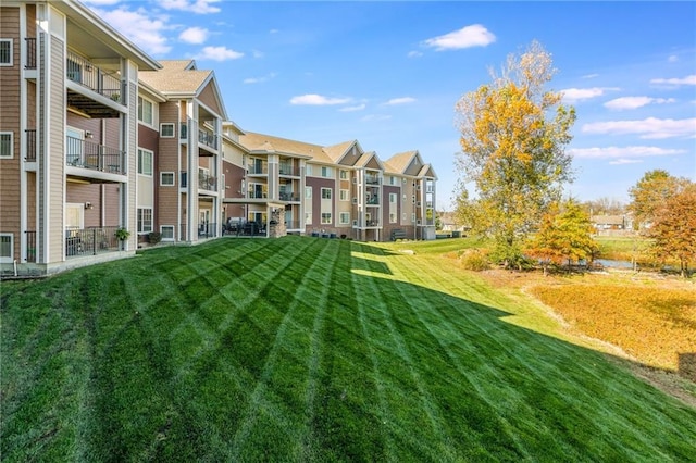 view of property's community with a yard