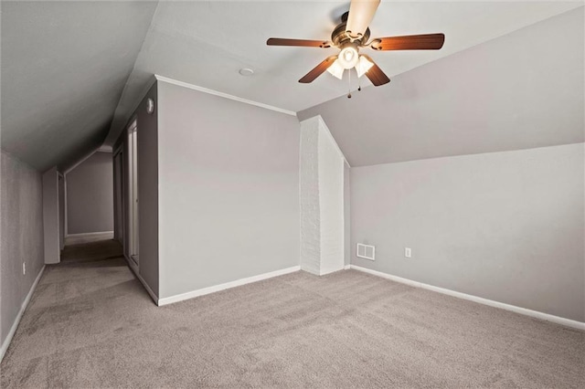 bonus room with light carpet, vaulted ceiling, and ceiling fan