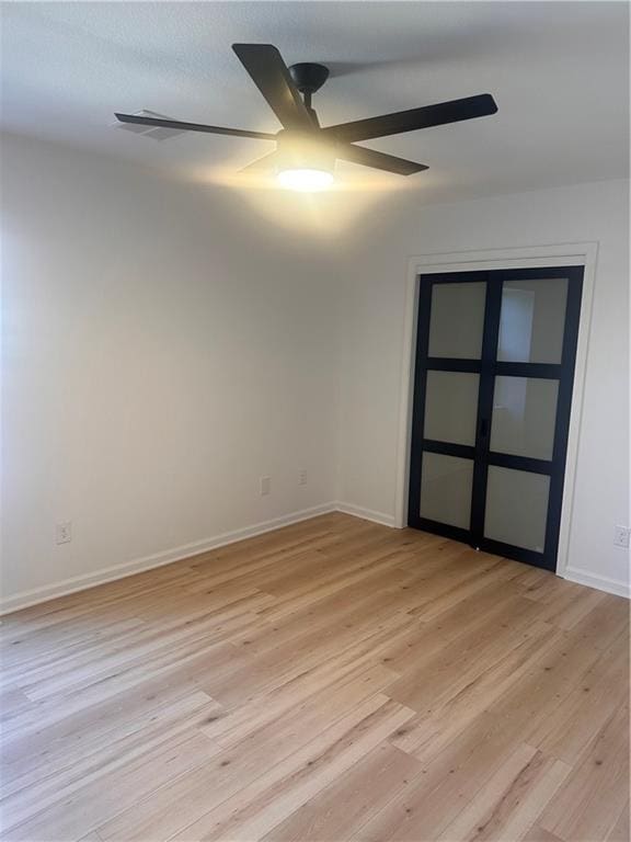 spare room featuring light wood-type flooring