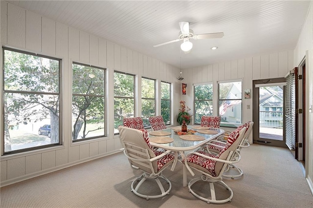 sunroom with a wealth of natural light and ceiling fan