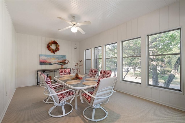 carpeted dining room featuring ceiling fan and breakfast area