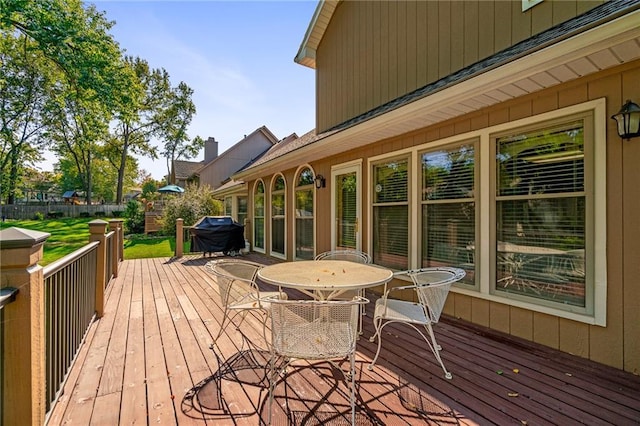 wooden deck featuring area for grilling