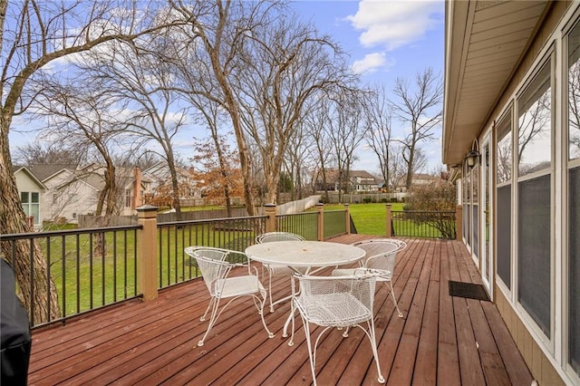 wooden deck featuring a yard