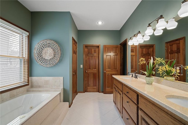 bathroom featuring vanity and a bath