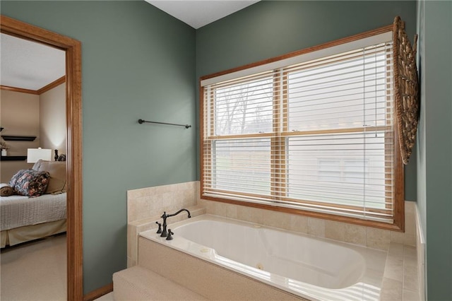 bathroom featuring tiled tub