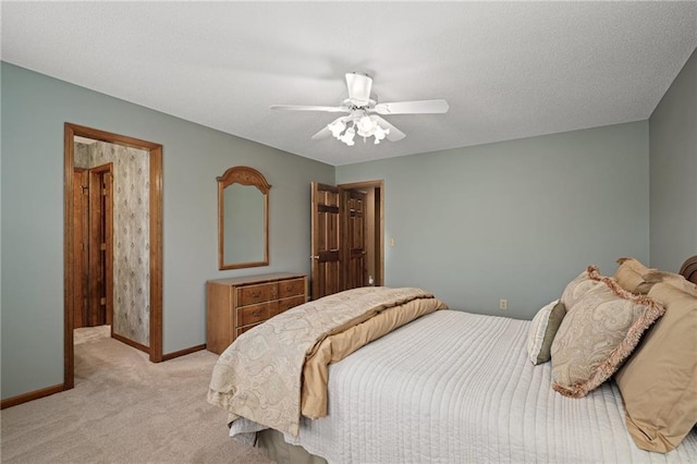 bedroom with ceiling fan and light carpet