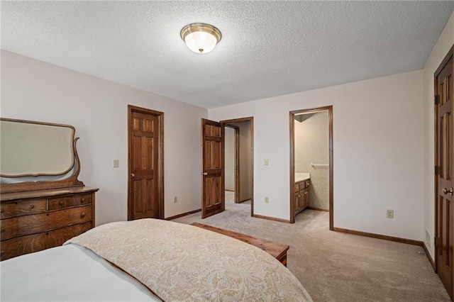 bedroom featuring light colored carpet and a textured ceiling