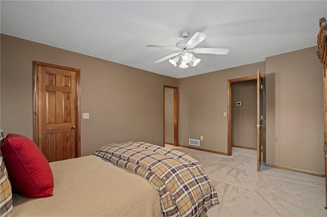 bedroom featuring ceiling fan and light colored carpet