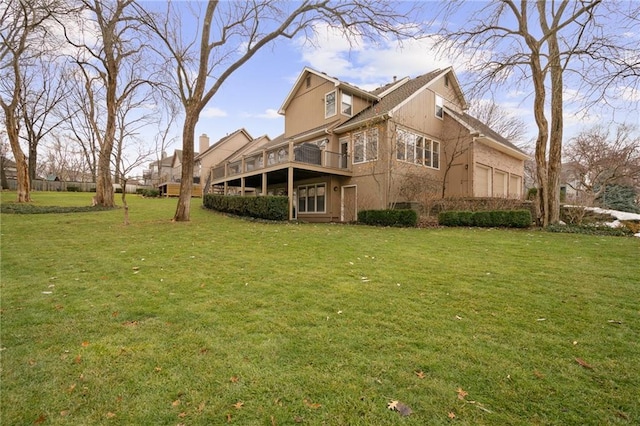 back of property featuring a yard and a deck