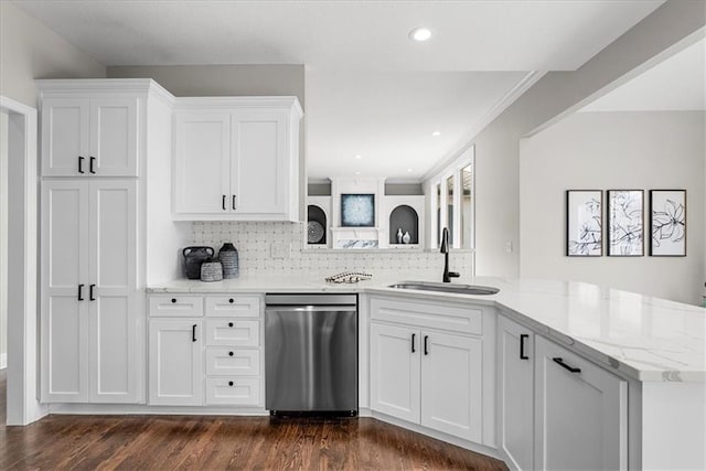 kitchen featuring white cabinetry, dishwasher, sink, and kitchen peninsula