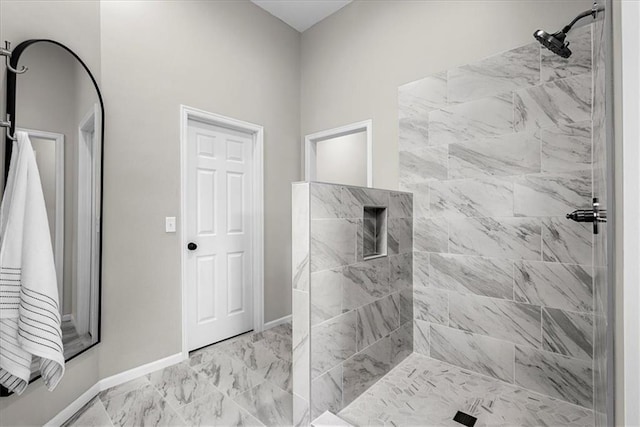 bathroom featuring tiled shower