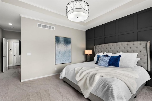 bedroom with crown molding and light colored carpet