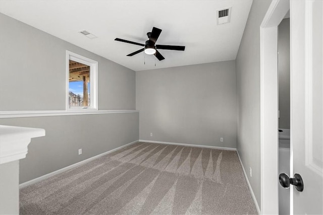 unfurnished room with ceiling fan and light colored carpet