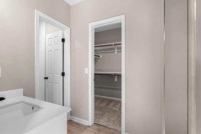 bathroom featuring sink and hardwood / wood-style floors