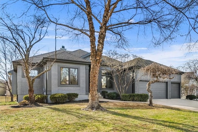 ranch-style house with a garage and a front lawn