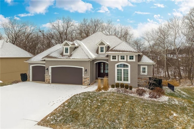 view of front of house with a yard and a garage