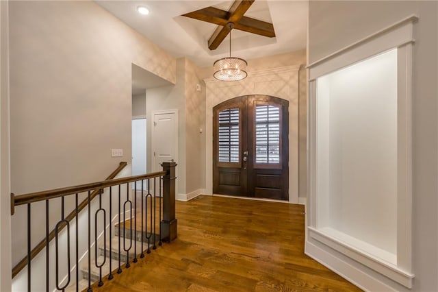 foyer entrance with french doors and dark hardwood / wood-style flooring