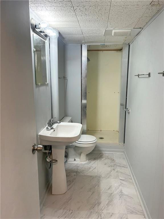 bathroom featuring toilet and walk in shower