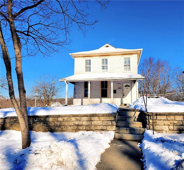 view of front of property featuring covered porch