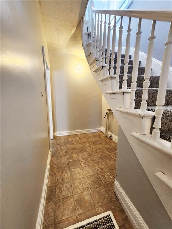 staircase with plenty of natural light