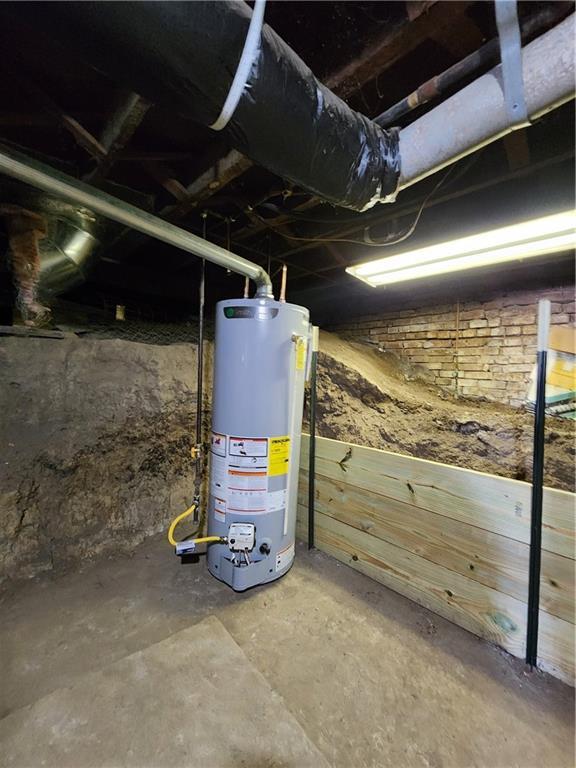 utility room featuring water heater