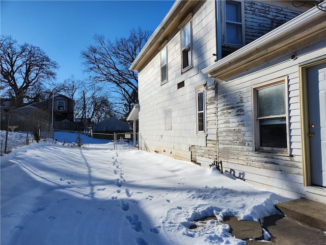 view of snow covered property