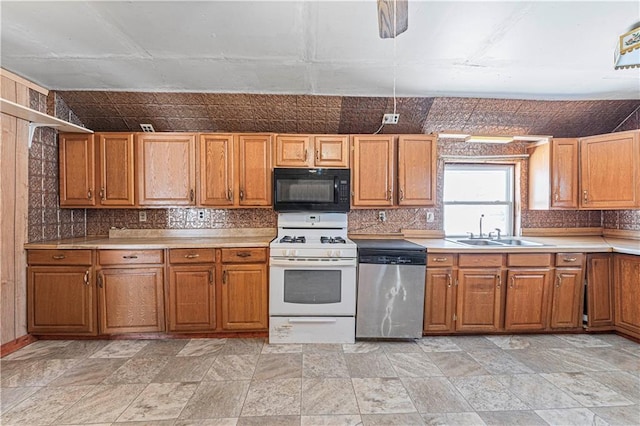 kitchen with stainless steel dishwasher, white gas range oven, and sink