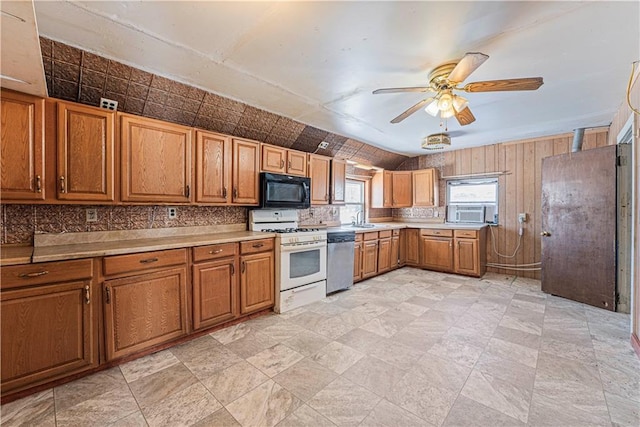 kitchen featuring ceiling fan, white range with gas stovetop, dishwasher, and sink