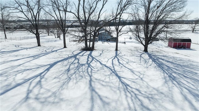 view of yard layered in snow